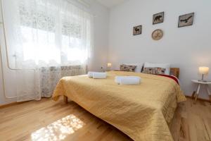 מיטה או מיטות בחדר ב-Holiday home Kairos