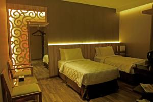 Postel nebo postele na pokoji v ubytování Oxville Hotel