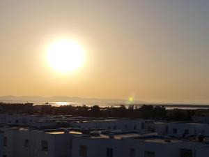 a view of the sunset from a building at Tonny House in La Marsa