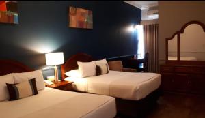Postel nebo postele na pokoji v ubytování Scala Hotel