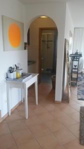 a kitchen with a white table in a room at Ferienwohnung Villa Bella Vista in Bad Sachsa