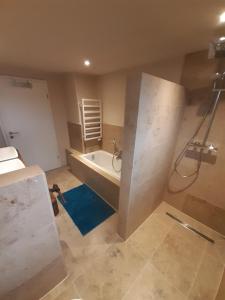 a bathroom being remodeled with a tub and a shower at FeWo für 2-6 Personen im Grünen in Freudenberg