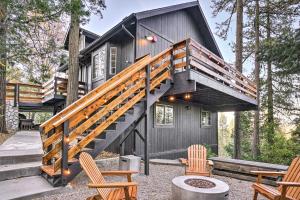 a house with a staircase leading up to it at Luxe Lake Arrowhead Getaway with Treetop Views! in Lake Arrowhead