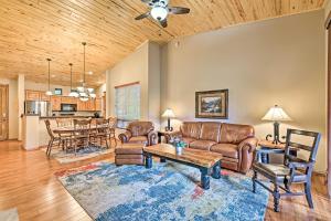 a living room with leather furniture and a table at Show Low Condo Less Than 1 Mi to Torreon Golf Club! in Show Low