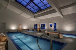 a large swimming pool with a large skylight at Parkway Inn of Jackson Hole in Jackson