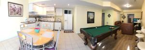 a living room with a pool table and a kitchen at Two bedroom apartment in single family home in Fort Washington +13 photos
