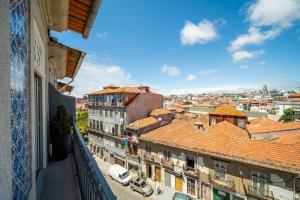 a view of a city from a balcony at Casa do Cativo in Porto