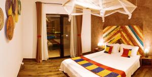 Postel nebo postele na pokoji v ubytování La Villa Awalie, maison de charme avec piscine + 8 fotografií