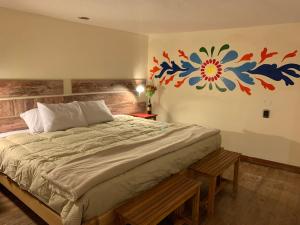 Postel nebo postele na pokoji v ubytování Gaia House Hostel