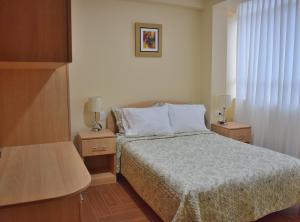 Ένα ή περισσότερα κρεβάτια σε δωμάτιο στο Apartamentos Las Americas