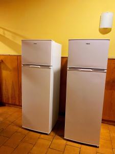 two old style refrigerators sitting next to each other at Hostel Napoles in Madrid