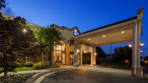 a building with a lit sign on the front of it at Best Western Historic Frederick in Frederick