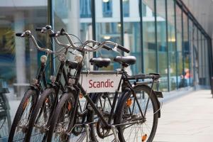 two bikes parked next to each other on a sidewalk at Scandic Hamburg Emporio in Hamburg