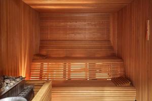 a sauna with wooden walls and a wooden floor at Scandic Hamburg Emporio in Hamburg