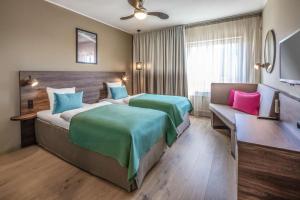 Postel nebo postele na pokoji v ubytování Quality Hotel The Reef