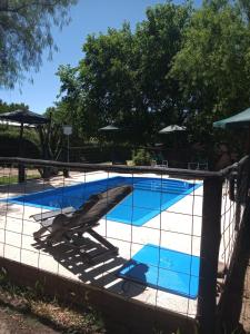 The swimming pool at or close to Complejo Los Ciruelos