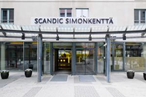 an entrance to a building with revolving doors at Scandic Simonkenttä in Helsinki