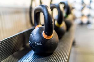 a row of black balls sitting on a bench at Scandic Kristiansand Bystranda in Kristiansand