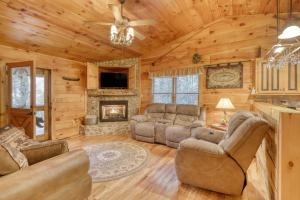 a living room with couches and a fireplace at Hillside Haven in Blue Ridge