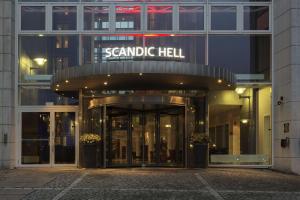 a building with a sign that reads senna hell at Scandic Hell in Hell