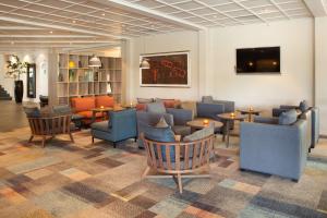 a lobby with couches and chairs and tables at Scandic Sørlandet in Kristiansand