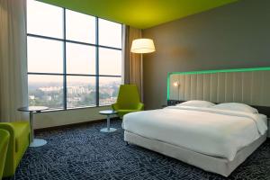 Кровать или кровати в номере Park Inn by Radisson, Nairobi Westlands