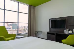 Кровать или кровати в номере Park Inn by Radisson, Nairobi Westlands