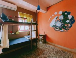 Letto o letti in una camera di Dulan Tranquilo Hostel 台東都蘭晃輕鬆背包客棧