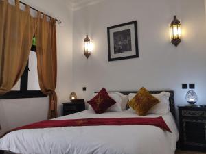 Voodi või voodid majutusasutuse Riad Dar Foundouk and Spa toas