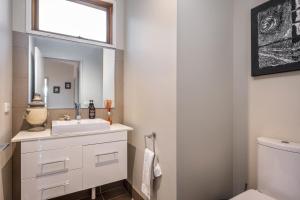 a bathroom with a sink and a mirror at Alinga in Dinner Plain