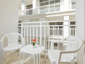 A balcony or terrace at Garden Phuket Hotel