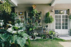 a bunch of plants on the side of a house at Civil Life Tainan in Tainan