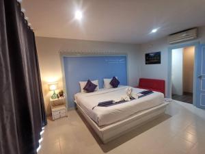 Postel nebo postele na pokoji v ubytování Phuket Racha Kata Homestay