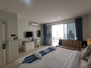 Postel nebo postele na pokoji v ubytování Phuket Racha Kata Homestay