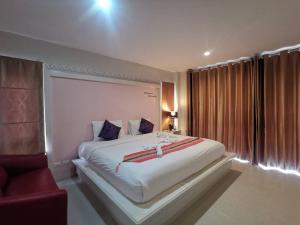Postel nebo postele na pokoji v ubytování Phuket Racha Kata Homestay