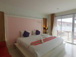 Postel nebo postele na pokoji v ubytování Phuket Racha Kata Homestay