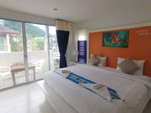 Postel nebo postele na pokoji v ubytování Phuket Racha Kata Homestay