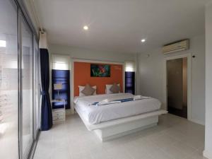 Postel nebo postele na pokoji v ubytování Phuket Racha Kata Homestay