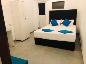 Postel nebo postele na pokoji v ubytování Double Mango Villa
