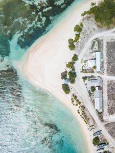 an aerial view of a beach next to the water at One The Island in Naifaru