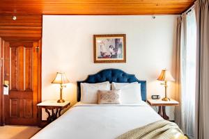 Postel nebo postele na pokoji v ubytování Gilbert Inn Seaside