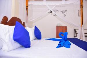 Letto o letti in una camera di Ocean Gate Villa Tangalle