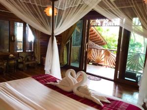 Cama ou camas em um quarto em Viking Nature Resort