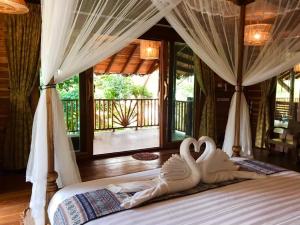 Cama ou camas em um quarto em Viking Nature Resort