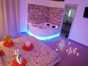 Postel nebo postele na pokoji v ubytování B&B La Perla & Suites