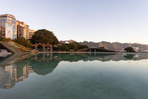 a large body of water with buildings and trees at Home2Book Amazing View Apart Floor 25 Santa Cruz in Santa Cruz de Tenerife