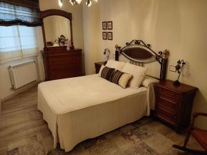 A bed or beds in a room at Perla del Cantábrico