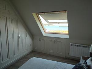 A bed or beds in a room at Perla del Cantábrico