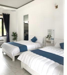 Giường trong phòng chung tại Gia An - hotel in Dalat