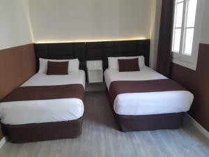 A bed or beds in a room at BCN Urbaness Hotels Bonavista